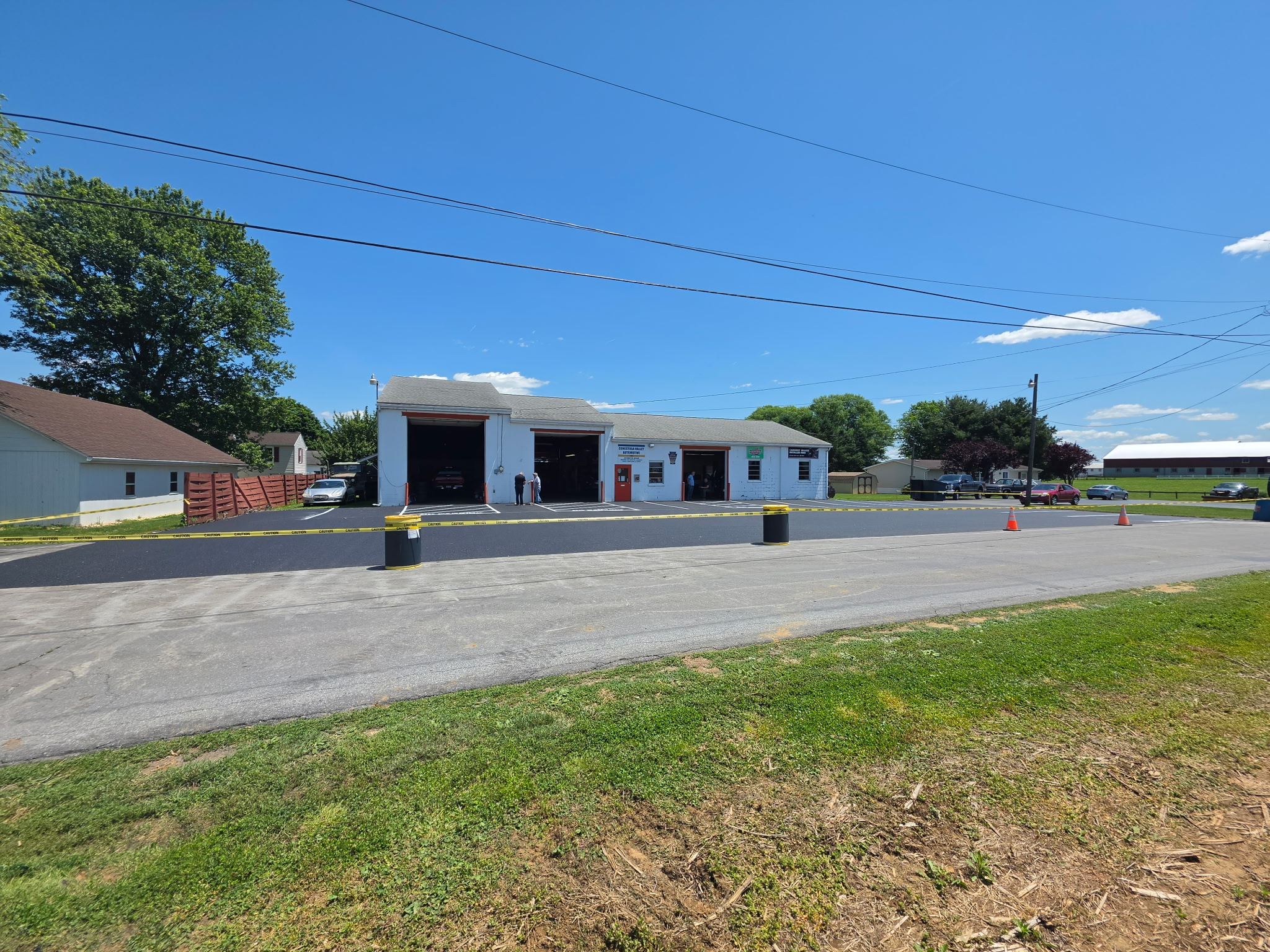CV Automotive shop exterior with freshly paved parking lot